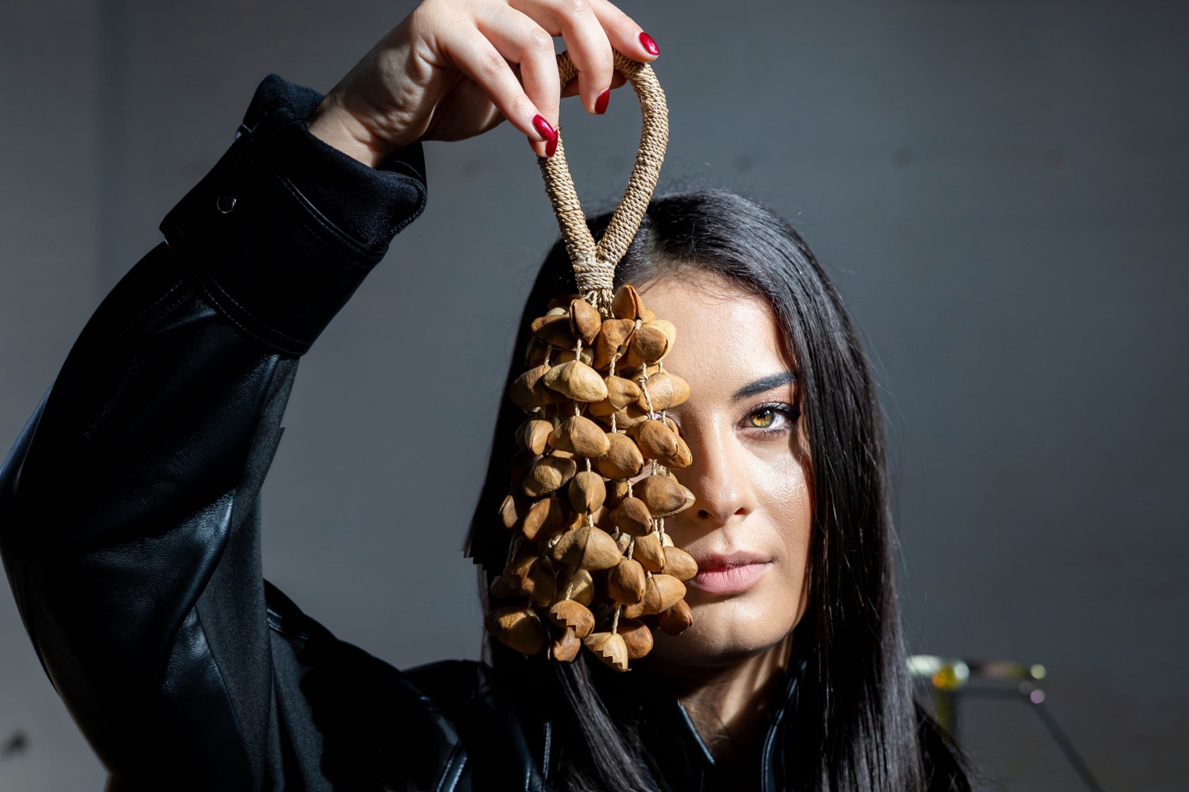 Alexandra holding a seed-shell shaker